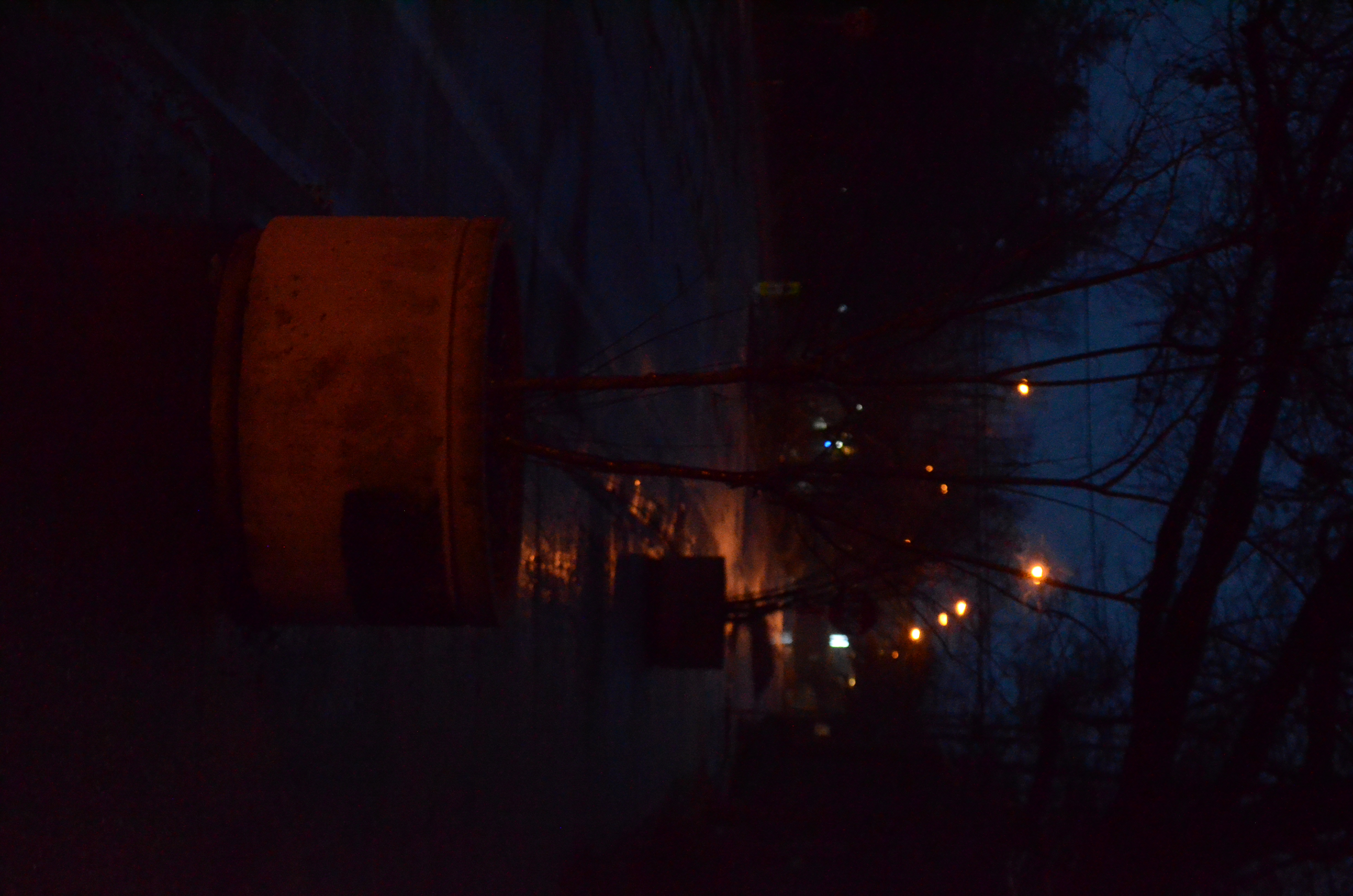 A picure of a plant pot which is has a red light on it